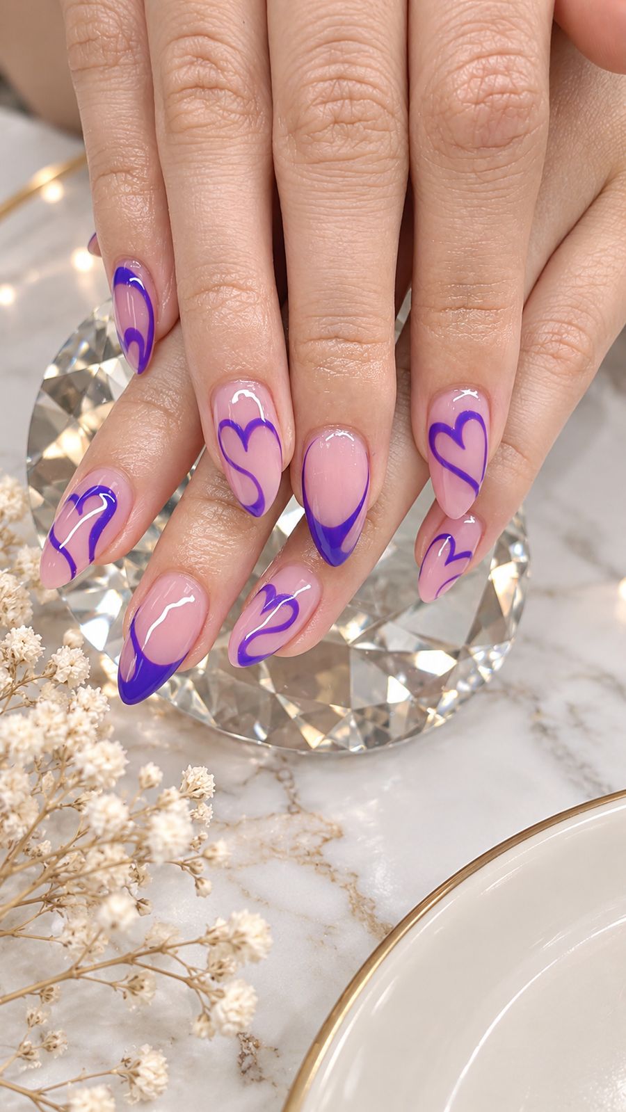 Almond nails with hand-painted purple heart design at AZ Nail Spa